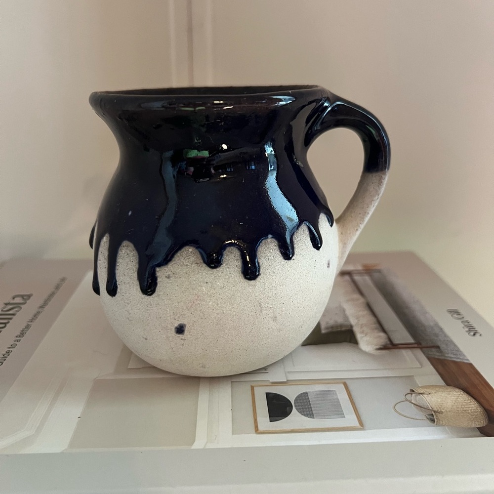 Pottery mug with indigo blue glaze drip